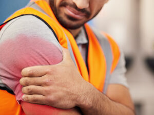 man with arm pain from work accident