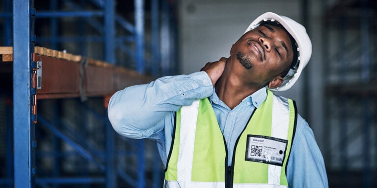 Man holding his neck in pain