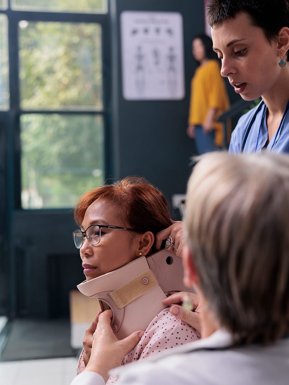 woman at a doctor office in a neck brace