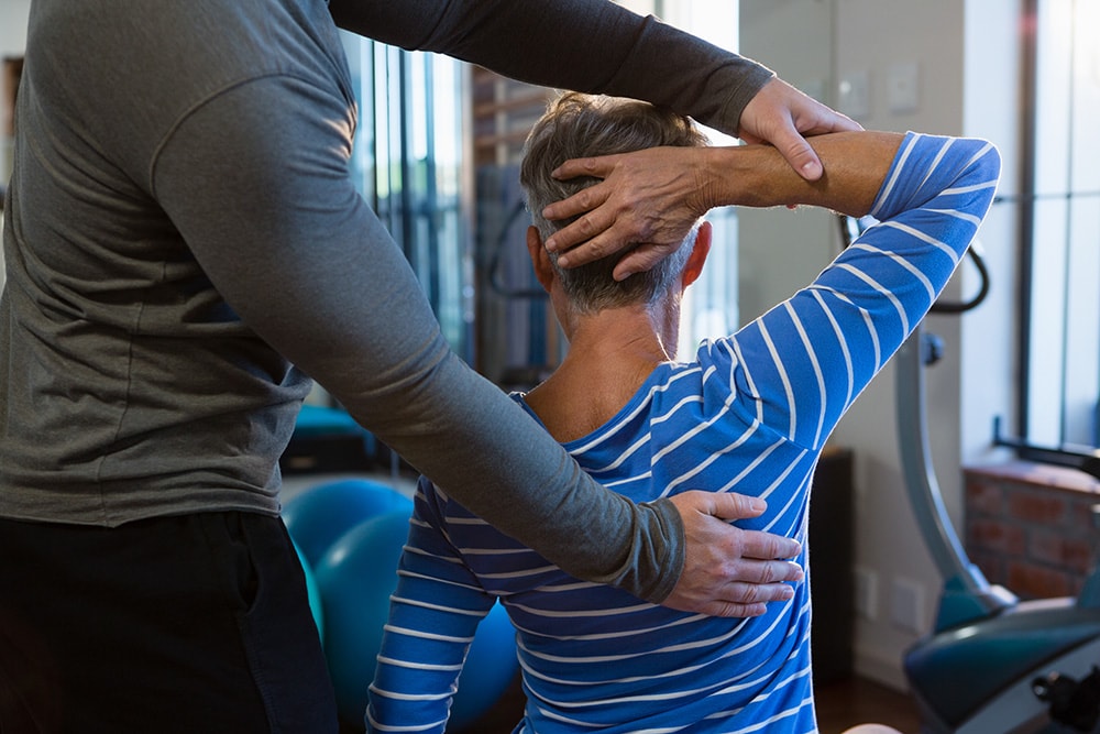 Woman getting therapy for her shoulder injury