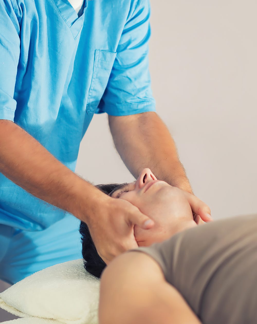 Man getting chiropractic work done on his neck