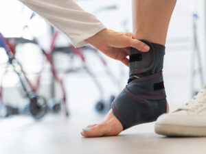 Woman getting treatment for an ankle injury